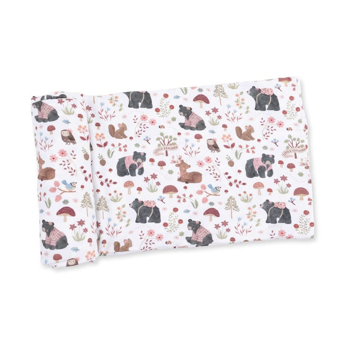 A folded fabric item, likely a blanket or swaddle, featuring a woodland animal print with bears, squirrels, rabbits, mushrooms, and wildflowers on a white background.