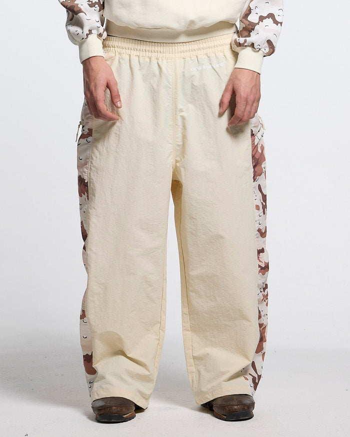 SPIDER PANTS BEIGE & CAMO - beige camo panel sweatpants, front view on male model - Cold Culture #man