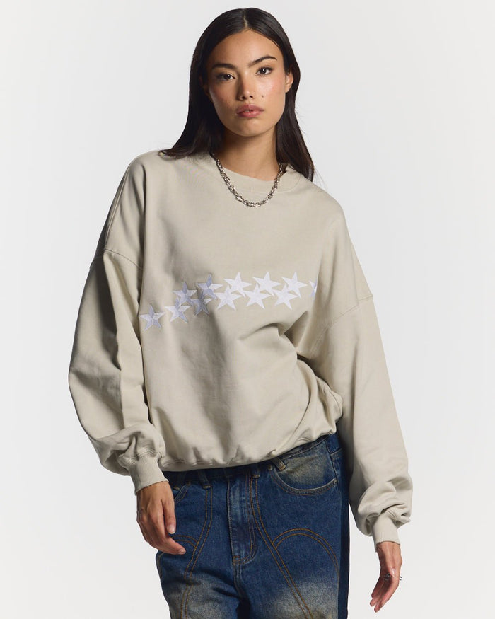 STARS CREWNECK PALE GREY - pale grey oversized crewneck sweatshirt, front view on female model - Cold Culture #woman