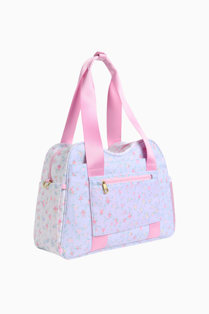 Light blue duffel bag with pink accents on a white background