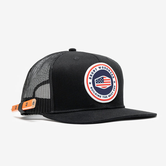 45 degree angle of front of flat brim work hat with built in pencil holder and BRUNT usa 250 logo in limited edition black