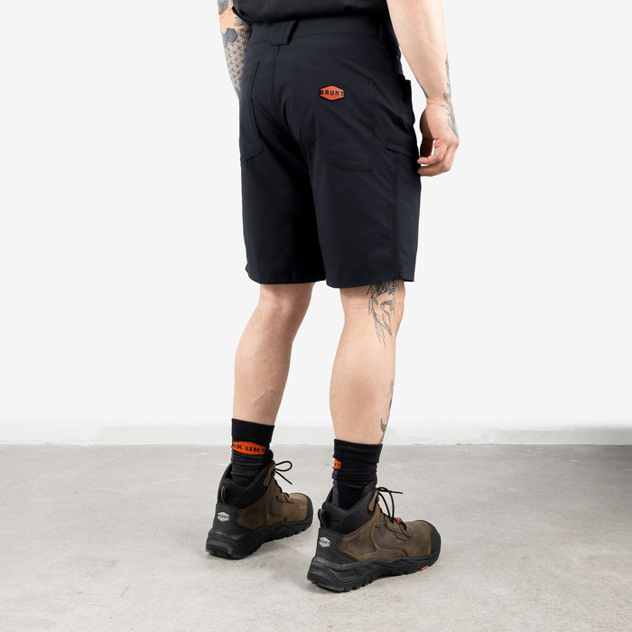 45 degree angle of back right side of BRUNT 11 inch lightweight breathable costello work shorts in black