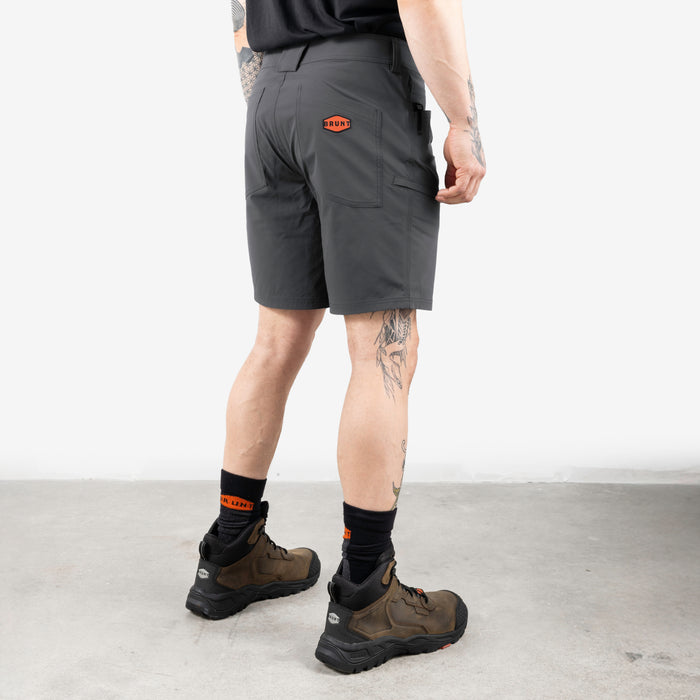 45 degree angle of back right side of BRUNT 9 inch lightweight breathable costello work shorts in charcoal