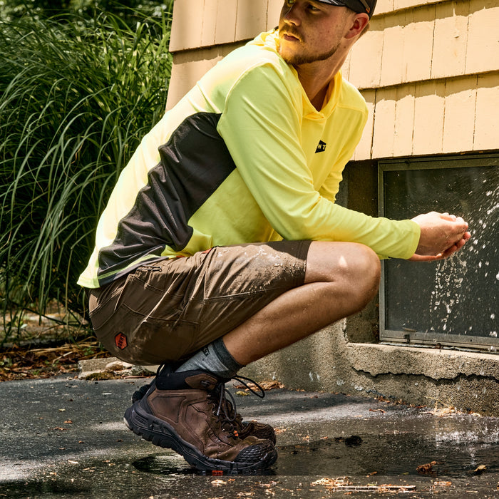 Man wearing BRUNT 6 inch reinforced toe work boot in brown on the jobsite