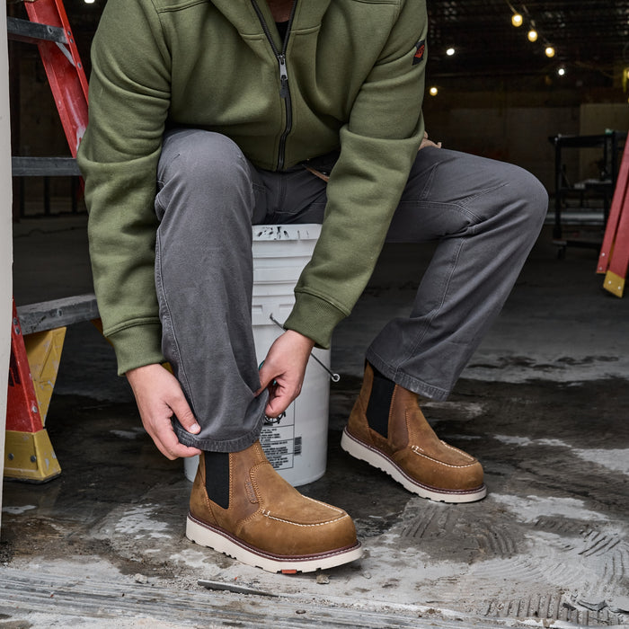 Man in BRUNT 6 inch water-resistant slip-on ohman moc toe work boot in brown