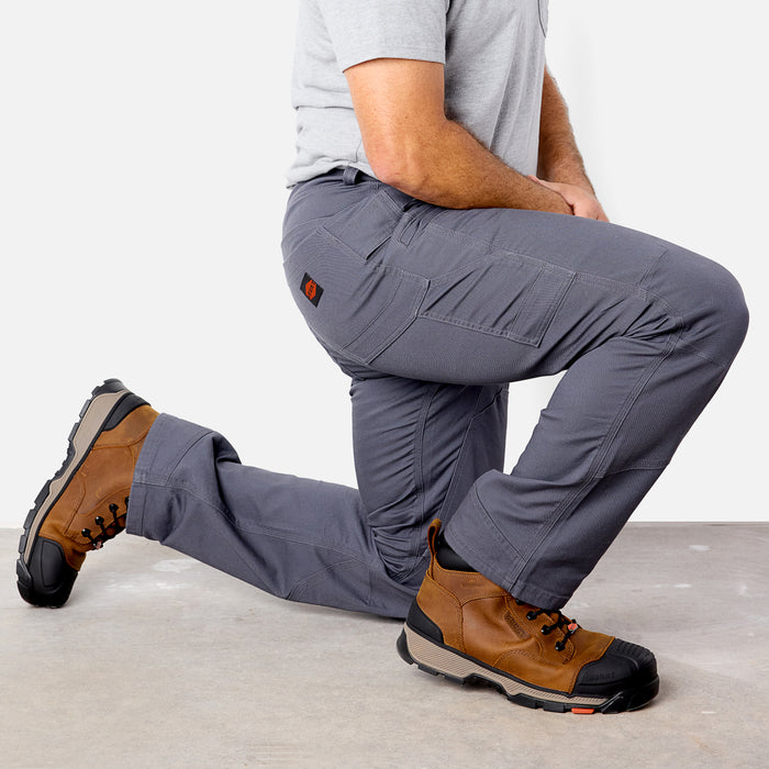 Sitting on one knee in BRUNT water resistant double-knee torra hd utility work pant in charcoal * 0