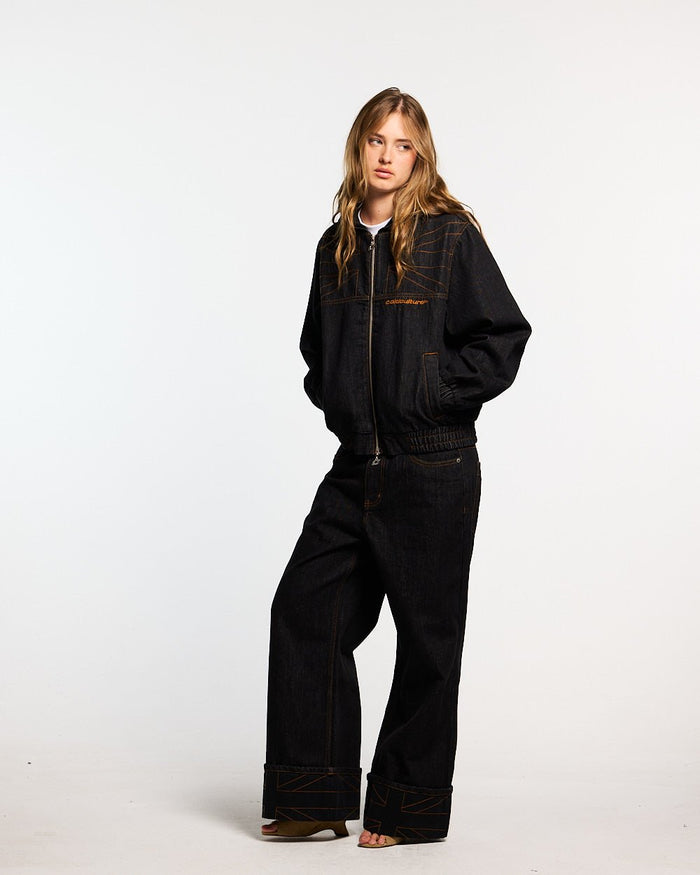 TOP BOY PANTS BLACK DENIM - black denim baggy pants, front view on female model - Cold Culture #woman