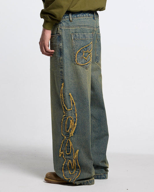TRIBAL DISTRESSED V2 PANTS GREEN WASHED DENIM - distressed green denim pants, back view on male model - Cold Culture #man