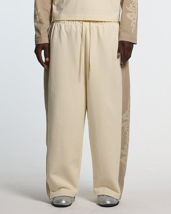 TRIBAL SWEATPANTS GREY & OFF WHITE - off white tribal sweatpants, front view on male model - Cold Culture #man