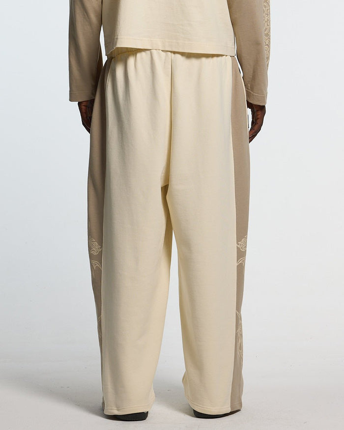 TRIBAL SWEATPANTS GREY & OFF WHITE - off white tribal sweatpants, back view on male model - Cold Culture #man