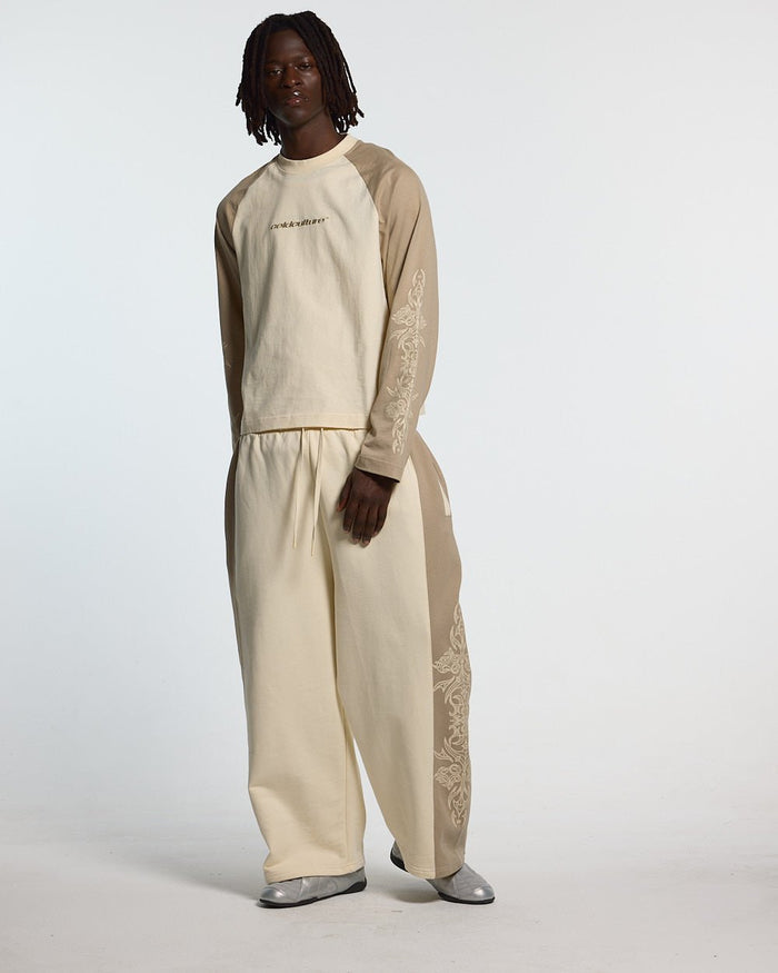 TRIBAL SWEATPANTS GREY & OFF WHITE - off white tribal sweatpants, front view on male model - Cold Culture #man