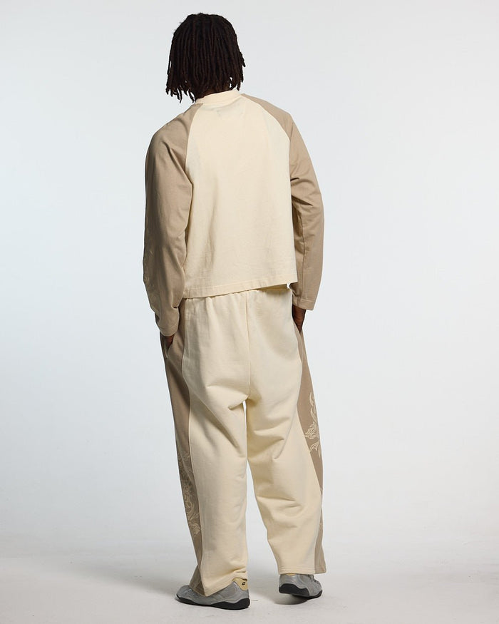 TRIBAL SWEATPANTS GREY & OFF WHITE - off white tribal sweatpants, back view on male model - Cold Culture #man