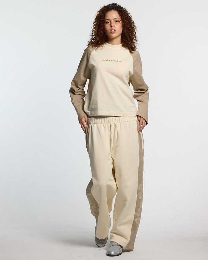 TRIBAL SWEATPANTS GREY & OFF WHITE - off white tribal sweatpants, front view on female model - Cold Culture #woman