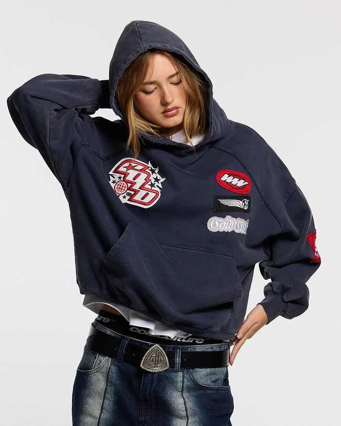 WALKER HOODIE DARK BLUE - dark blue hoodie with patches, front view on female model - Cold Culture #woman