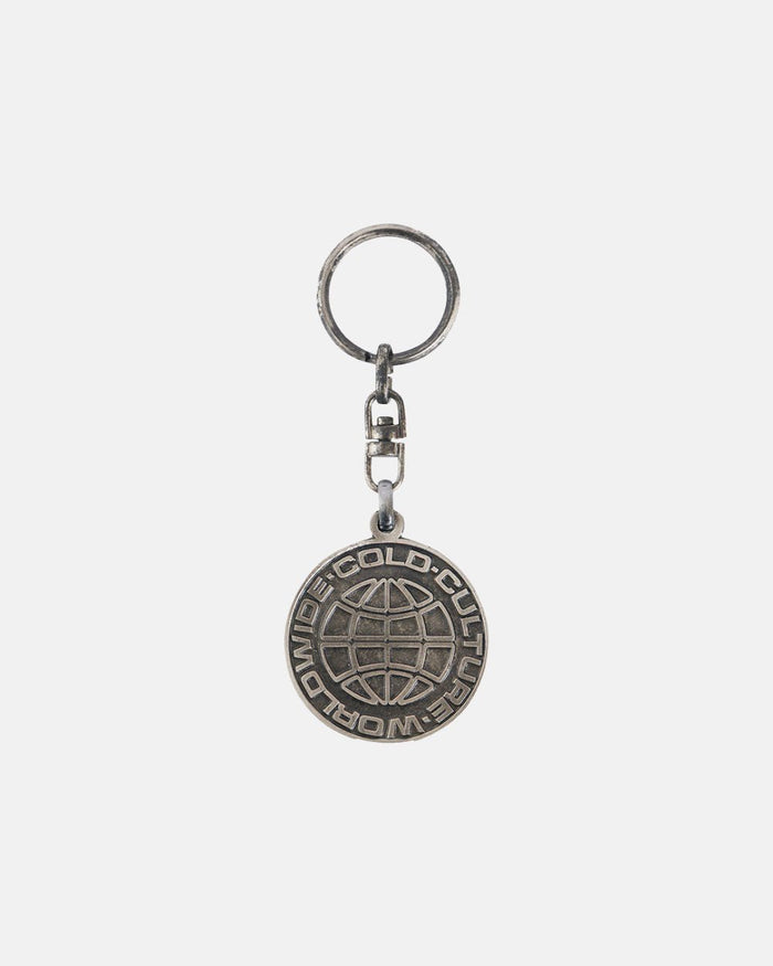 WORLD LOGO METAL KEYCHAIN - silver metal logo keychain, front view - Cold Culture