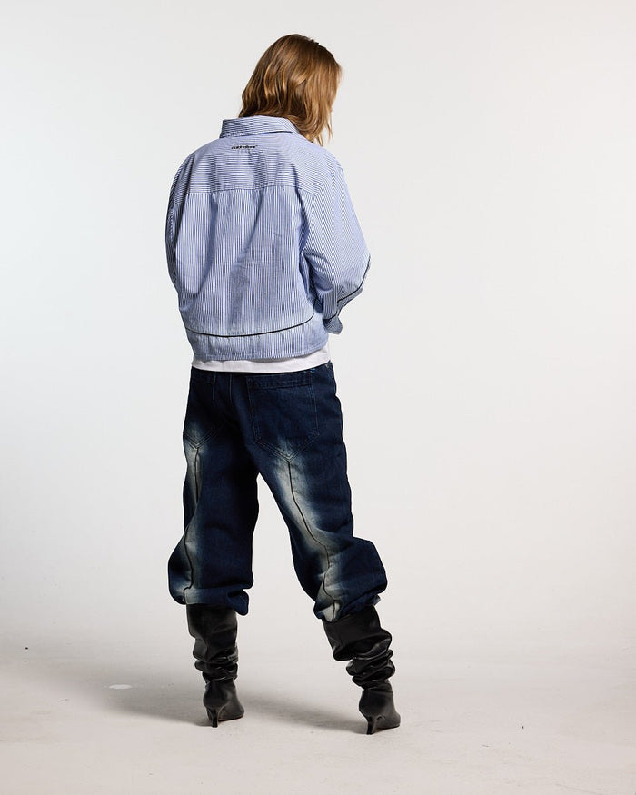 WORLDWIDE V2 PANTS DARK DENIM - dark denim baggy pants, back view on female model - Cold Culture #woman
