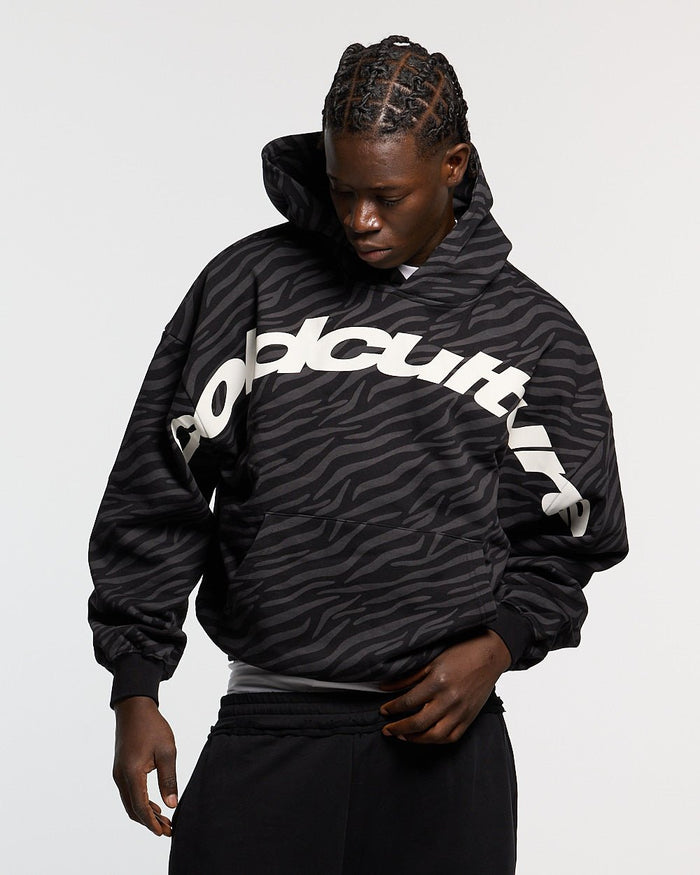 ZEBRA HOODIE BLACK - black zebra print hoodie, front view on male model - Cold Culture #man